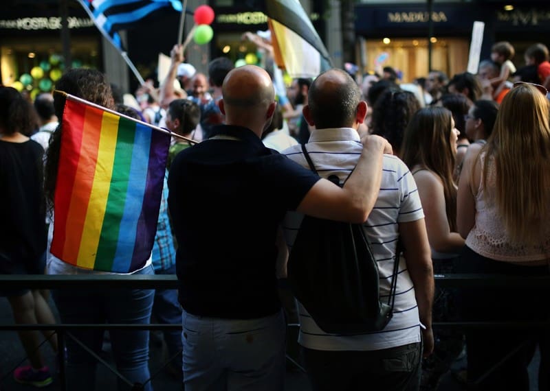 Two men take part in the annual Gay Pride parade in Athens, where same sex marriage has finally been legalized.