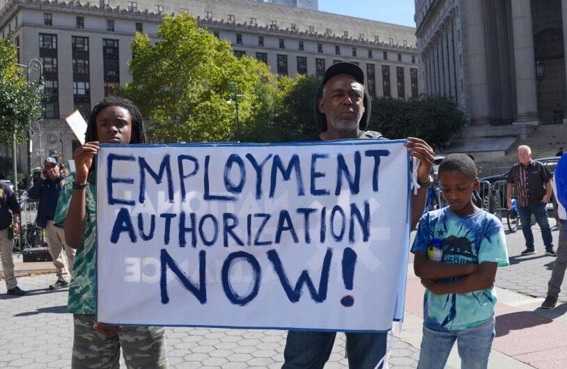 NEW YORK, UNITED STATES - AUGUST 31: Participants stage a demonstration as New York City Mayor Eric Adams hosts rally and delivers remarks calling for expedited work authorization for asylum seekers in New York, United States on August 31, 2023. (Photo by Selcuk Acar/Anadolu Agency via Getty Images)