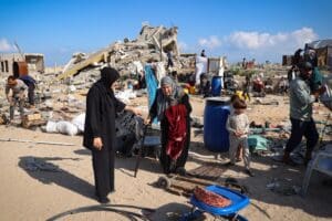 people standing among rubble in Palestine